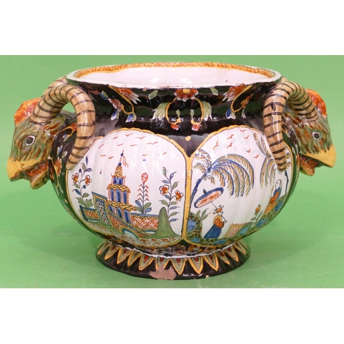 81 - A Continental Glazed Majolica Round Bulbous Thin Necked Trumpet Shaped Jardiniere having raised anim... 