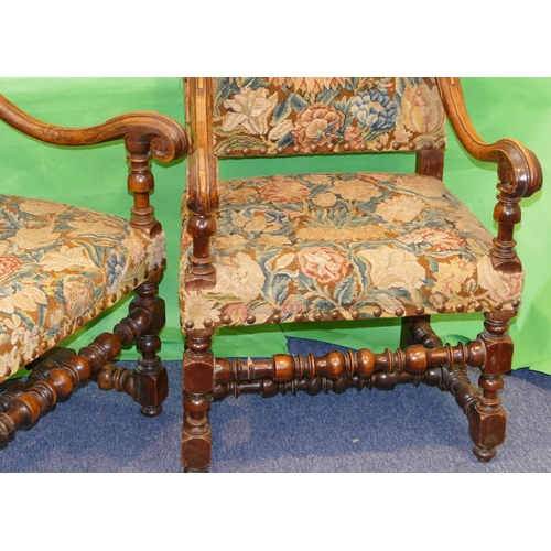 861 - A Pair of 18/19th Century Walnut Framed Armchairs having scroll arms, turned bobbin supports and str... 