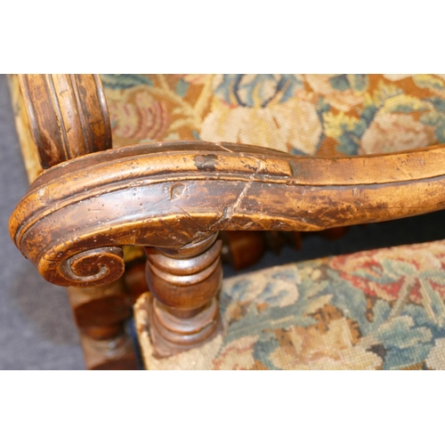 861 - A Pair of 18/19th Century Walnut Framed Armchairs having scroll arms, turned bobbin supports and str... 