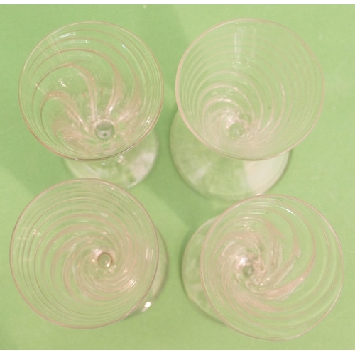 131 - 4 x Similar Georgian Twist Trumpet Shaped Wine Glasses on round sweeping bases, 12.5cm high.