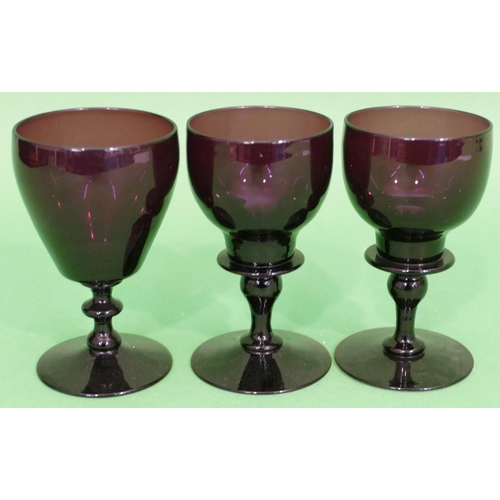 134 - A Pair of Georgian Purple Wine Glasses having bulbous stems on sweeping bases, also another similar ... 