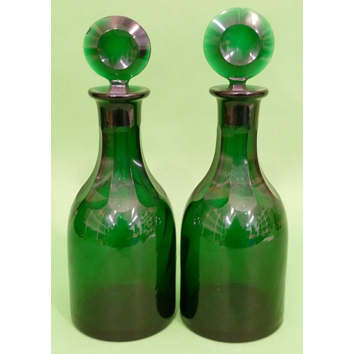 136 - A Pair of Georgian Green Glass Decanters with flat stoppers having thumb pattern necks (slight chip ... 