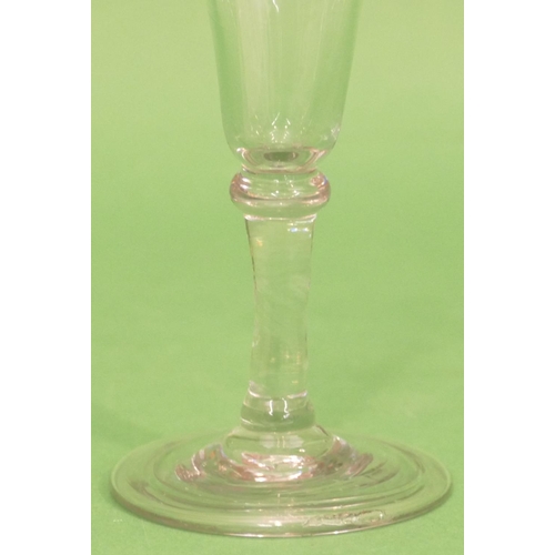 145 - A Georgian Round Cordial Glass on knob stem on round sweeping foot (uneven edge to part of foot) 12.... 