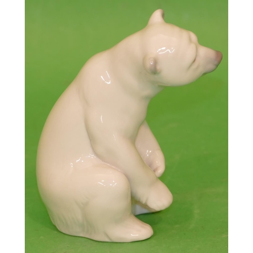 153 - A Lladro Figure of a seated polar bear, 12cm high.