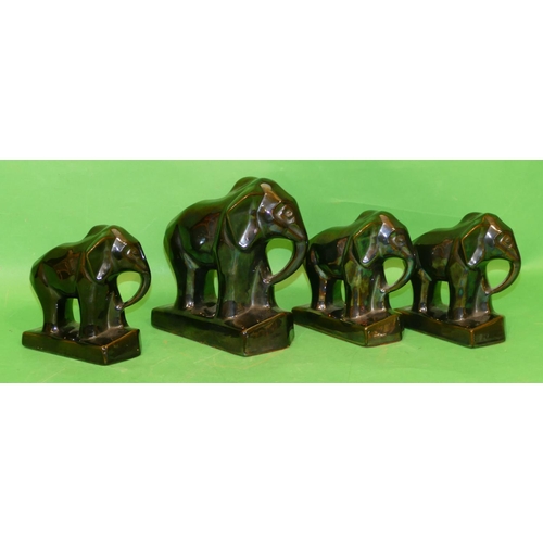 165 - A Lustre Figure of an elephant on rectangular shaped base, 20.5cm high, also 3 other similar smaller... 