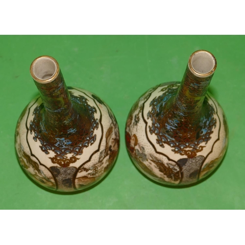 184 - A Pair of Oriental Round Bulbous Thin necked Bottle Vases on cream ground with panels of figures, an... 