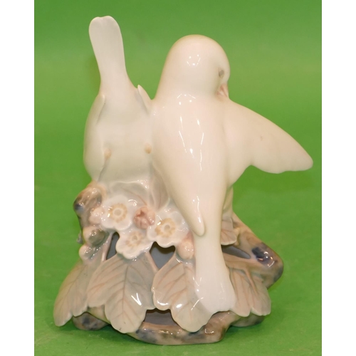 209 - A Copenhagen Group of 2 white birds on leaves, numbered 402, 13.5cm high.