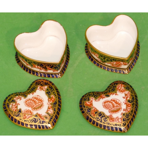 212 - A Pair of Royal Crown Derby Heart Shaped Lidded Trinket Boxes on white, blue and red ground with flo... 