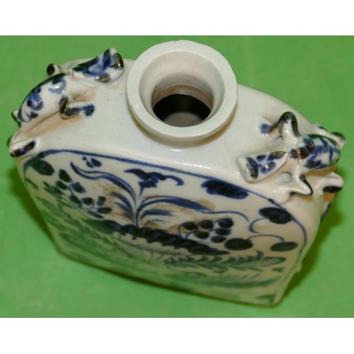 218 - An Oriental Blue and White Thin Necked Bottle having raised insect motif, duck, floral and leaf deco... 