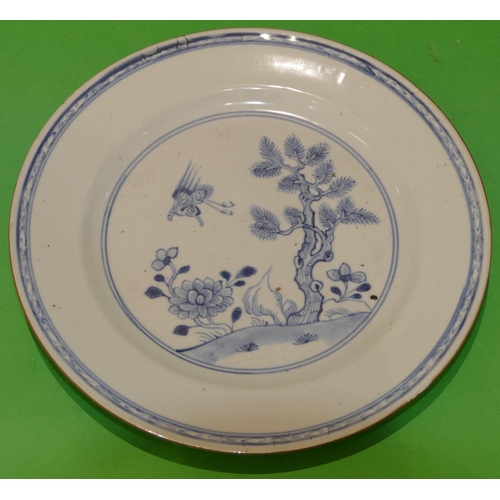 24 - An 18th Century Chinese Blue and White Plate having bird, tree and floral decoration to centre, 23.3... 