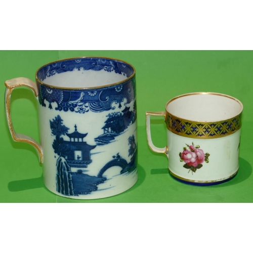 46 - A 19th Century Derby Mug on white and blue ground having hand painted rose, leaf and gilt decoration... 