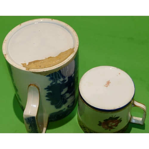 46 - A 19th Century Derby Mug on white and blue ground having hand painted rose, leaf and gilt decoration... 