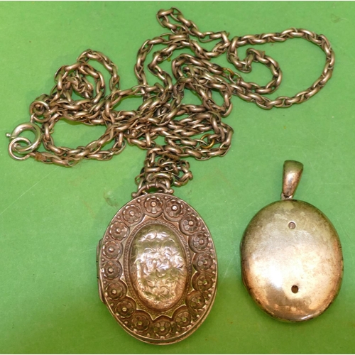 531 - An Oval Silver Locket (embossed front pushed in), with guard chain, also an oval (part missing to fr... 