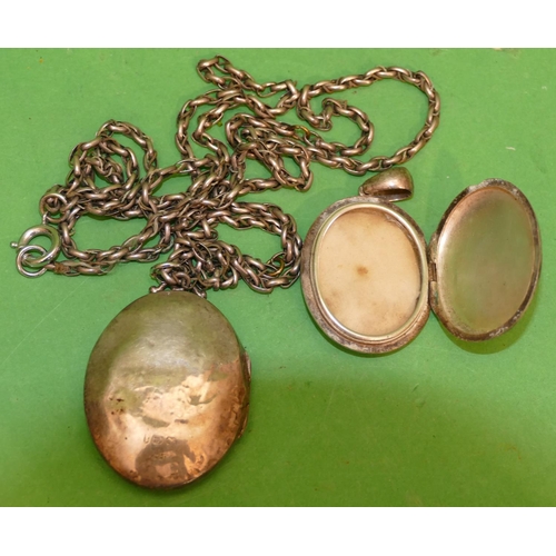 531 - An Oval Silver Locket (embossed front pushed in), with guard chain, also an oval (part missing to fr... 