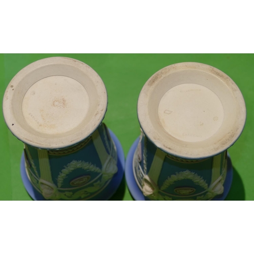 60 - A Pair of Wedgwood Jasperware Round Trumpet Shaped Urns having raised plaques, swag, lion head ring ... 