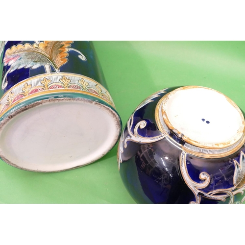 80 - A Continental Glazed Earthenware Cylindrical Umbrella Stand on royal blue ground with multicoloured,... 