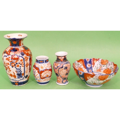 82 - An Imari Round Bulbous Small Thin Necked Trumpet Shaped Vase on red, white and blue ground with flor... 