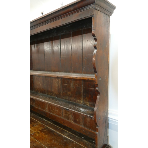 968 - An 18th Century Oak Dresser having shelf back, open cupboard below, with shaped splat to centre, hav... 