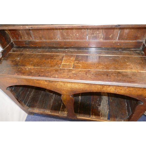 968 - An 18th Century Oak Dresser having shelf back, open cupboard below, with shaped splat to centre, hav... 