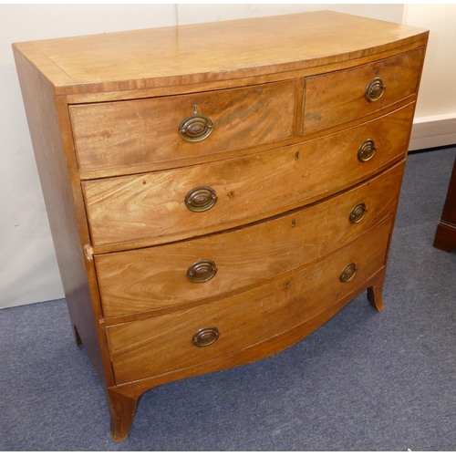 969 - A 19th Century Mahogany Bow Fronted Chest of Drawers having part inlaid stringing, 2 drawers, 3 long... 