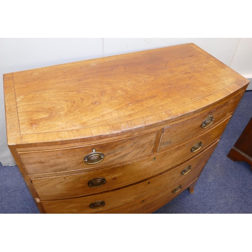 969 - A 19th Century Mahogany Bow Fronted Chest of Drawers having part inlaid stringing, 2 drawers, 3 long... 