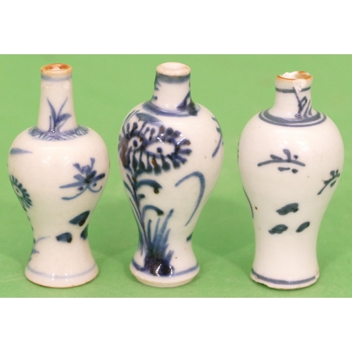 97 - A Chinese Blue and White Round Bulbous Thin Necked Small Vase having floral decoration, 7cm high, al... 