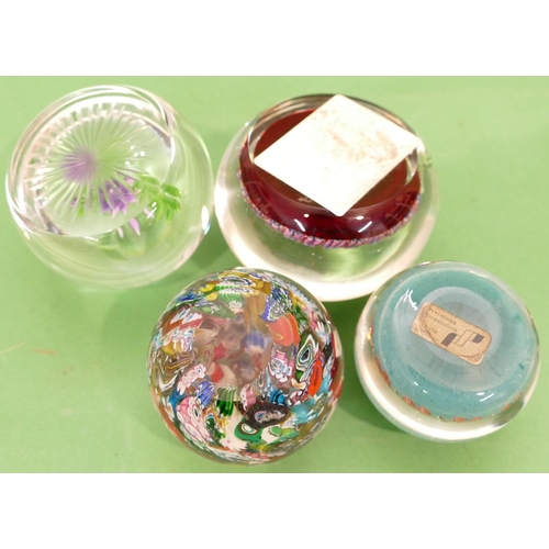 100 - A Caithness Paperweight having floral motif, also 3 other paperweights (4).