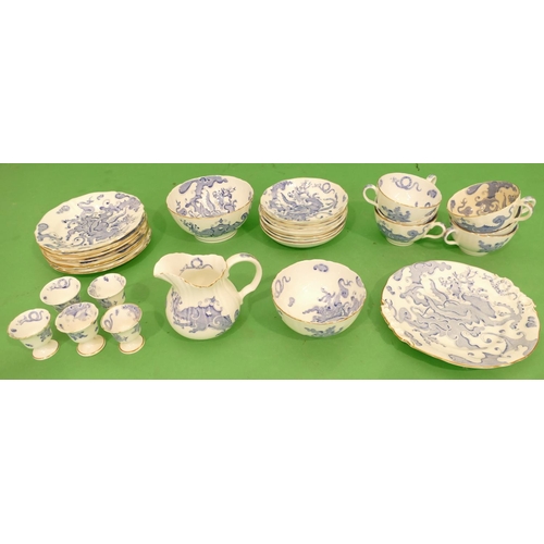 102 - A Royal Worcester Part Service on blue and white ground having dragon decoration, comprising milk ju... 