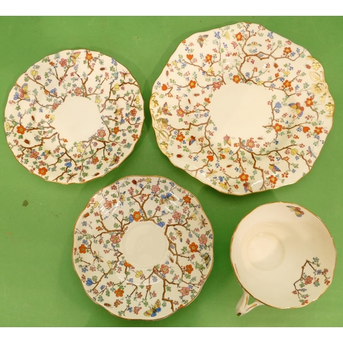 103 - A Copeland Spode Part Service on white ground with multicoloured butterfly branch and floral decorat... 