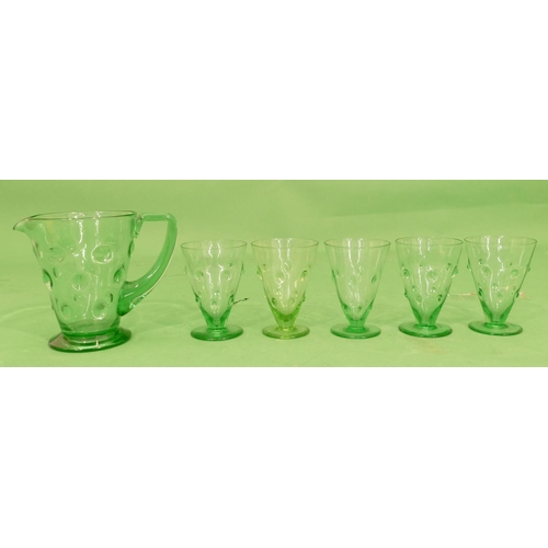 105 - A Green Glass Lemonade Set having raised knob decoration comprising jug and 5 matching trumpet shape... 