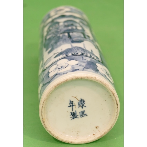 108 - A 19th Century Chinese Cylindrical Vase on blue and white ground with river landscape, building and ... 