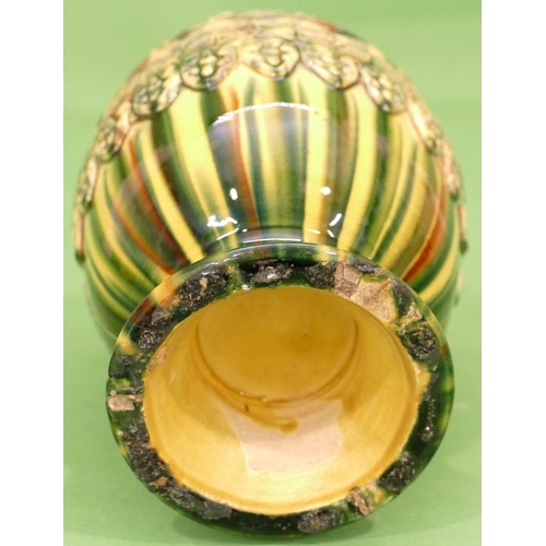 148 - A Glazed Earthenware Round Bulbous Thin Necked Trumpet Shaped Vase on green and yellow ground with r... 