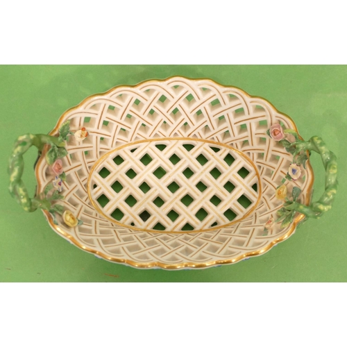 165 - A Meissen Oval Basket having all over pierced and encrusted floral decoration, entwined twist handle... 