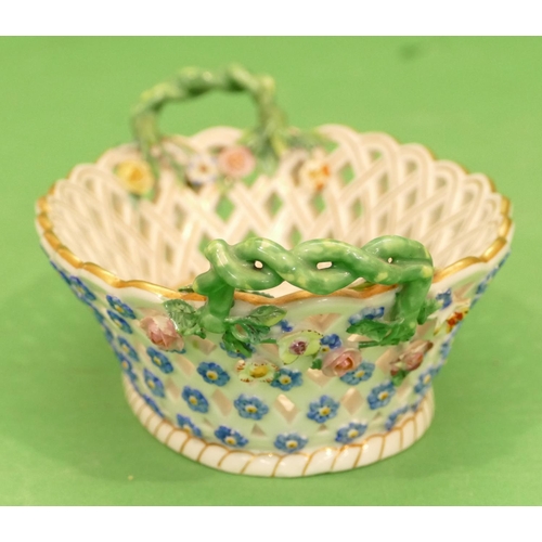 165 - A Meissen Oval Basket having all over pierced and encrusted floral decoration, entwined twist handle... 