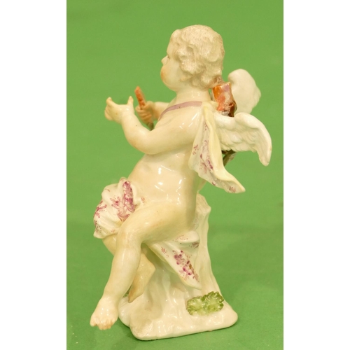 175 - A Meissen Figure of a seated cupid (restored) 11.5cm high.