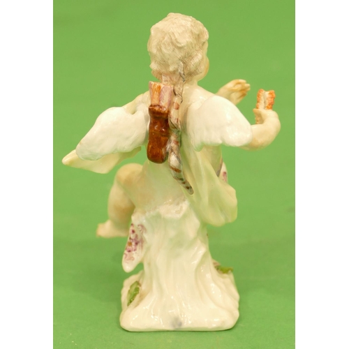 175 - A Meissen Figure of a seated cupid (restored) 11.5cm high.