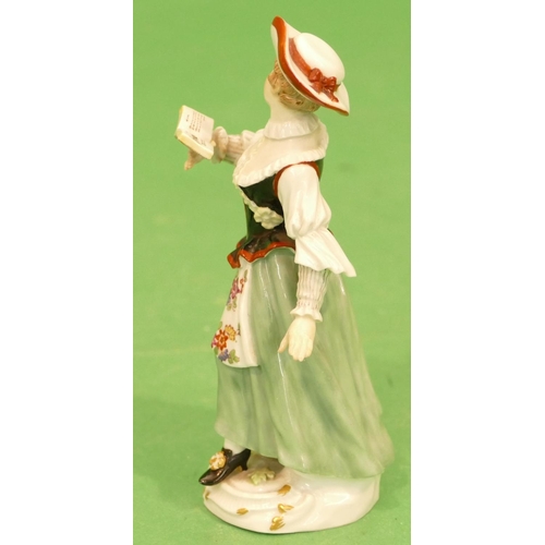 176 - A Meissen Figure of a young lady walking and  reading a book (left hand restored) 13.5cm high.