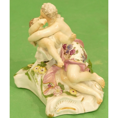 177 - A Meissen Group of a seated lady holding a child having encrusted and painted floral decoration (nec... 