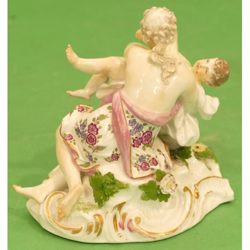 177 - A Meissen Group of a seated lady holding a child having encrusted and painted floral decoration (nec... 