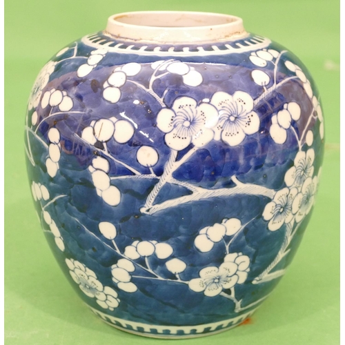 183 - A 19th Century Chinese Round Bulbous Ginger Jar on blue and white ground having all over branch and ... 