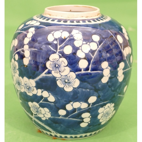 183 - A 19th Century Chinese Round Bulbous Ginger Jar on blue and white ground having all over branch and ... 