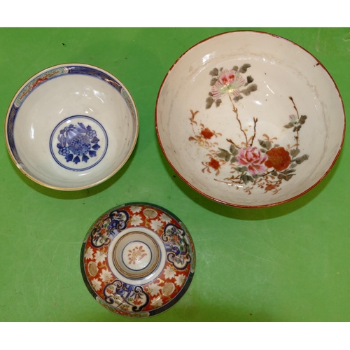 219 - An Oriental Round Bowl and Cover on white, blue and red ground with multicoloured floral and gilt de... 