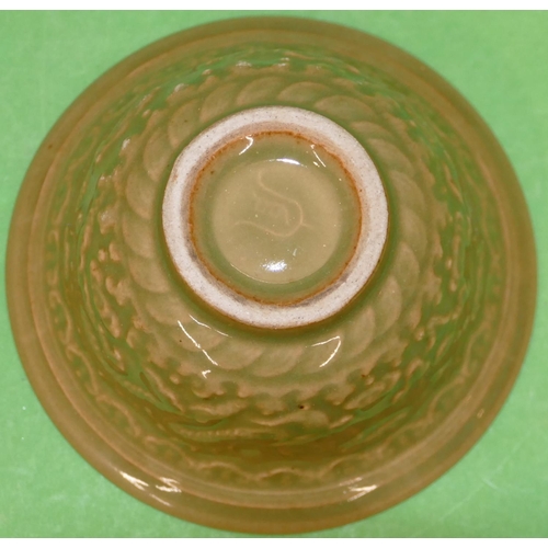 223 - An Oriental Round Trumpet Shaped Bowl on green ground with raised dragon decoration, 12cm diameter.