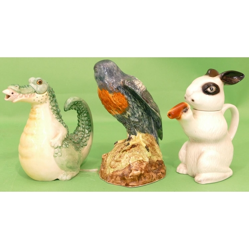 23 - A China Figure of a perched bird 26cm high, a Tony Wood teapot in form of a rabbit and another teapo... 