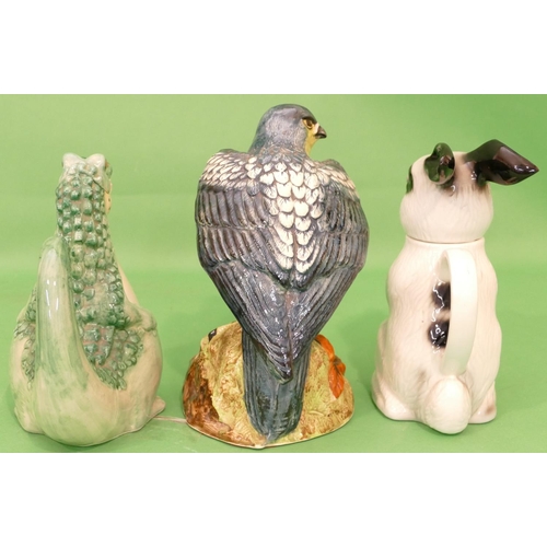 23 - A China Figure of a perched bird 26cm high, a Tony Wood teapot in form of a rabbit and another teapo... 