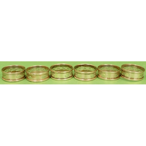 303 - A Set of 6 x Birmingham Silver Round Napkin Rings having pierced key pattern decoration, 2oz.