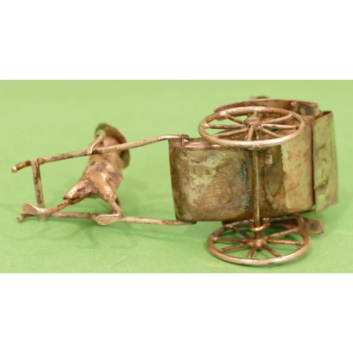 304 - A Continental Silver Coloured Metal Miniature Rickshaw, 8.5cm long, 1oz.