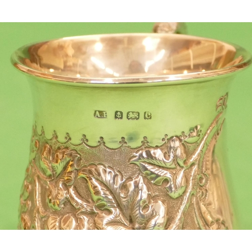 332 - An Edward VII Silver Round Bulbous Shaped Christening Mug having scroll handle with all over embosse... 