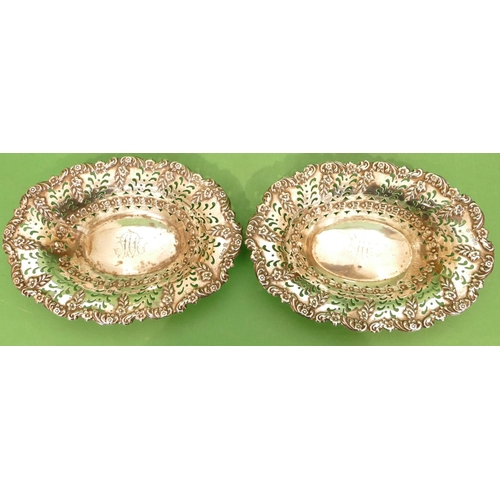 334 - A Pair of Edward VII Silver Oval Sweetmeat Dishes having scallop shaped rims with embossed and pierc... 