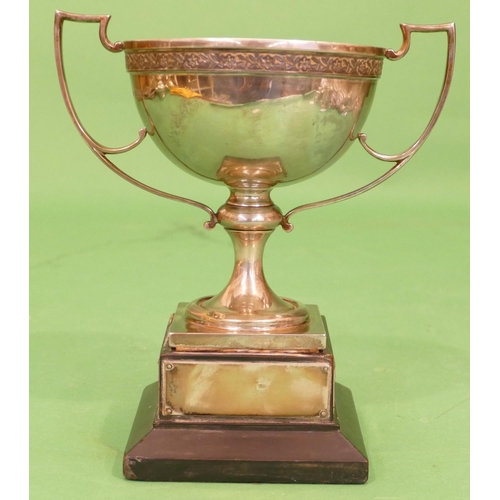 335 - A George V Silver Golfing 2 Handled Trophy with engraved inscription on square base having further e... 